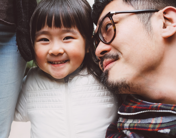 Father and daughter smiling
