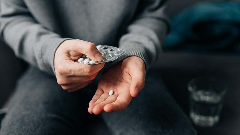 A person with tablets in their hands.