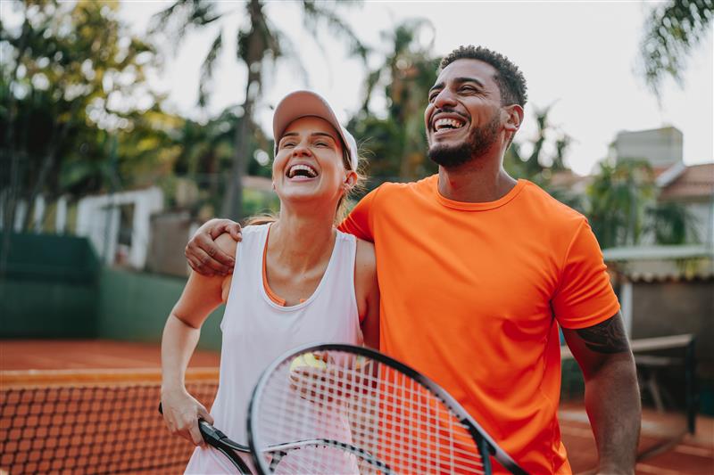 Man and woman playing tennis