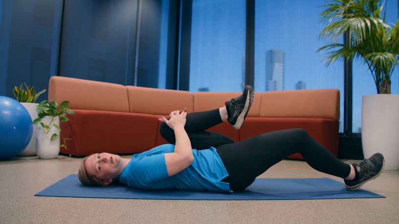 Bupa physio Carly Stewart demonstrating lower back stretches.
