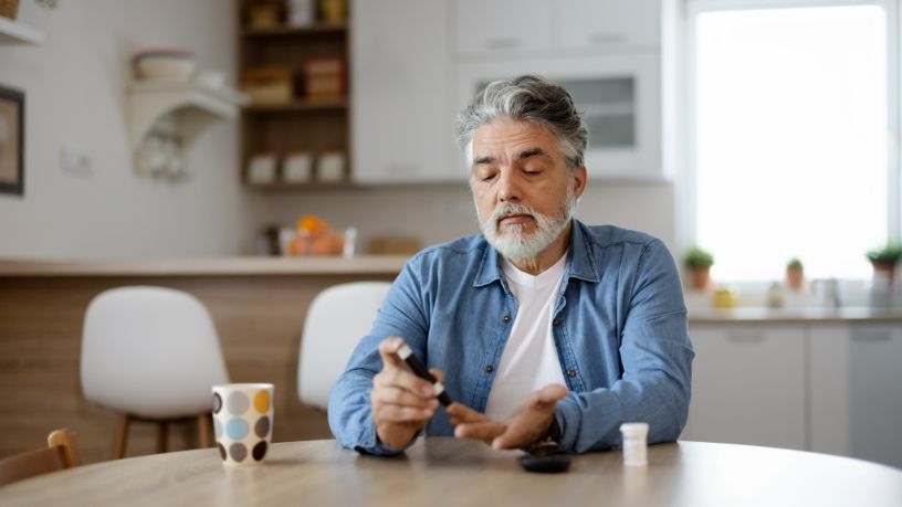 A man tests his blood glucose levels.