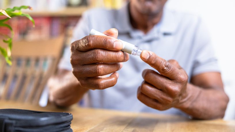 A man testing his glucose levels