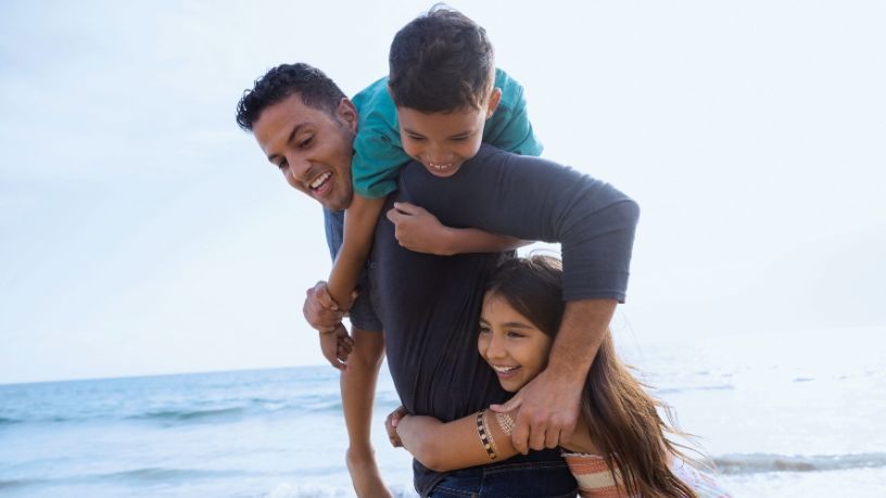 Dad with 2 kids outside.