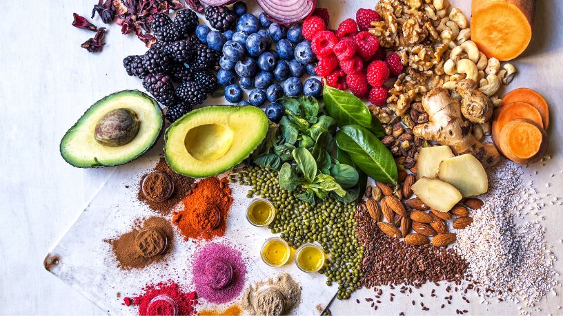 An array of anti-inflammatory foods laid out on a bench.