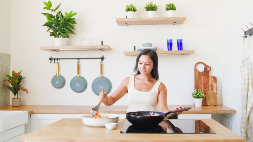 Bupa dietitian cooking in the kitchen.