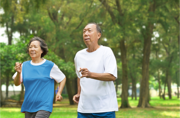 Elderly couple jogging together